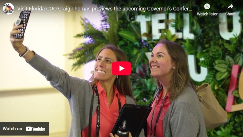 Two women taking a selfie at conference.