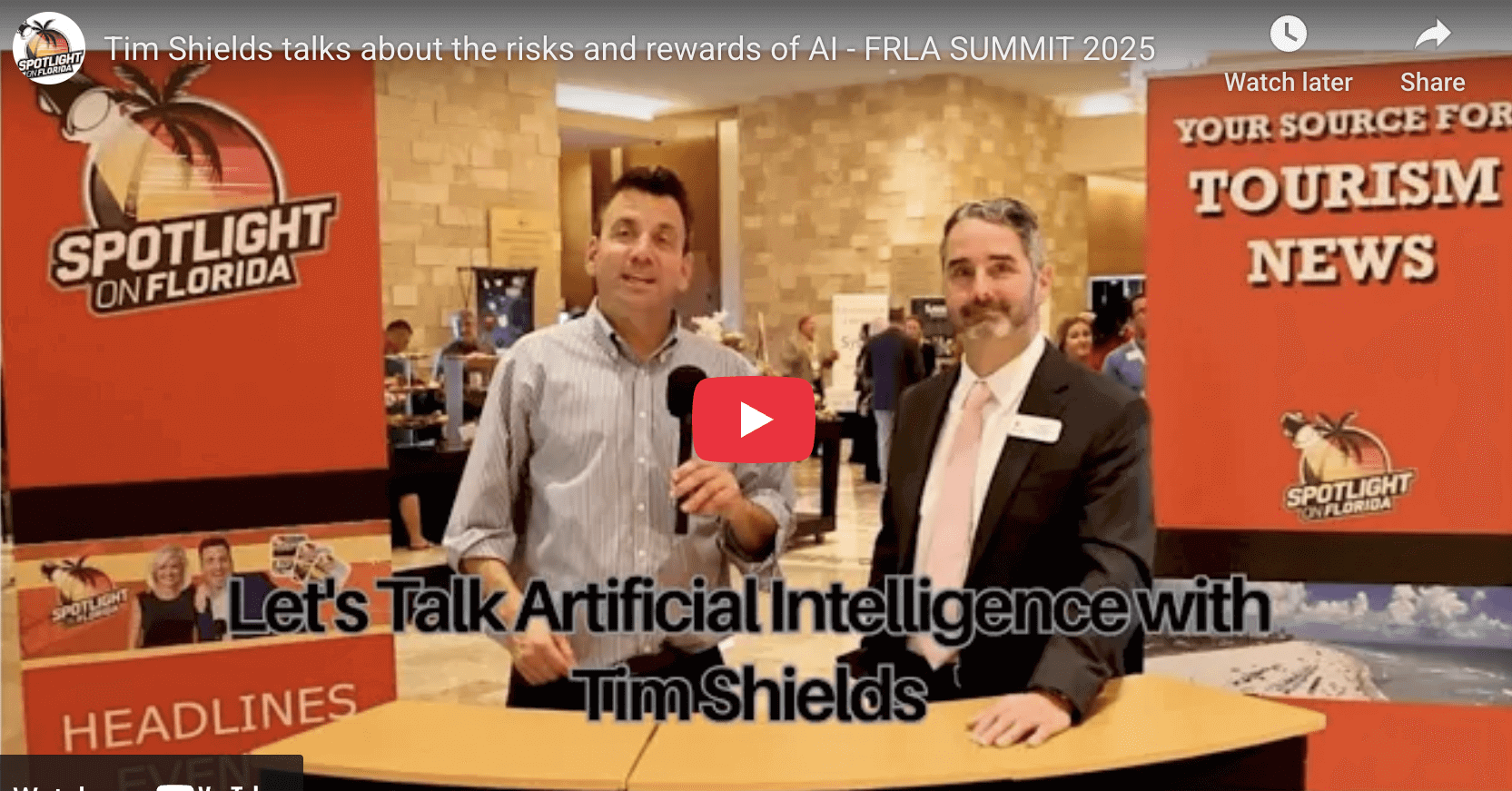 Two men discussing artificial intelligence at summit.