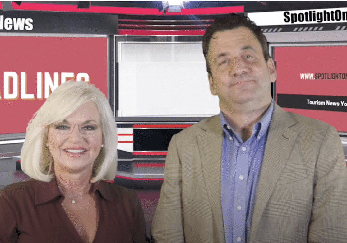 Two people in a news studio.