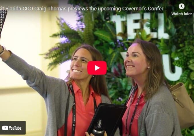 Two women taking a selfie at conference.